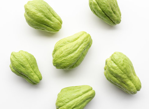 Directly above view of chayote or choko arranged on a white table