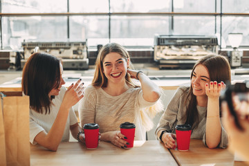 Smiling cheerful woman talk to her friends