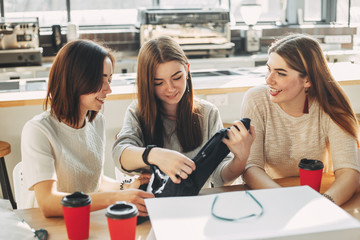 Friends viewing new clothes after shopping