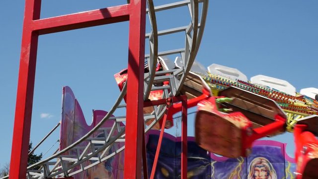 Fast carousel in motion, in an amusement park. Adrenaline fun.