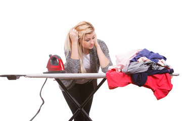 Woman holding iron about to do ironing