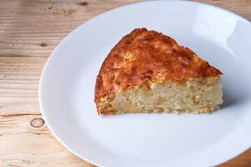 tasty apple pie slice on white plate