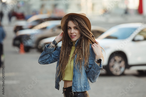 Street Style Stylish Woman With Dreadlocks Walking In City