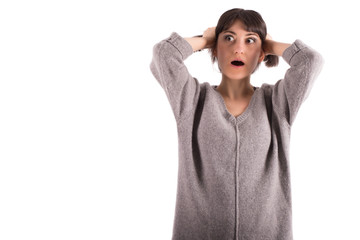 Young Woman Pulling Her Hair with Wide Open Eyes