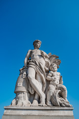 Fototapeta na wymiar Sculpture of farmer and his scholar on Zoll Bridge in Magdeburg downtown, Germany