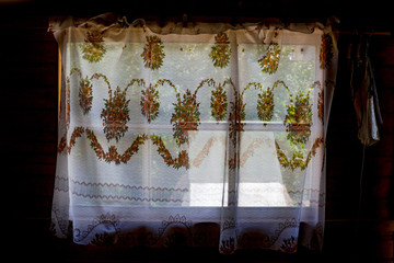 Curtains on the window of the village house
