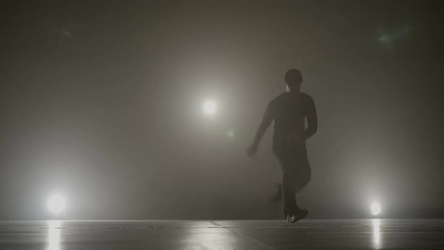 Choreographer dancing on the stage showing professional hip hop modern break dance moves