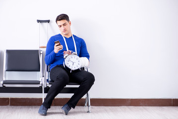 Desperate man waiting for his appointment in hospital with broke