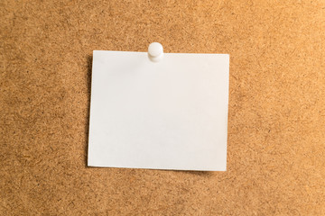 white sticker for notes on a cardboard background