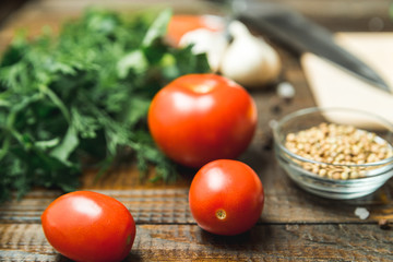 vegetables, herbs and seasonings lie on the table