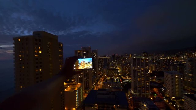 POV on the taking picture in Honolulu City in Hawaii at night in 4K