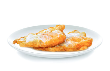 Fried eggs in white plate on white background