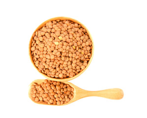 Brown Lentils in wood bowl isolated on white background