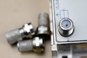 F-type connector in the enlargement. Accessories used for the installation of cable television.