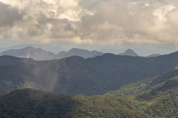 Clouds and a rain shower over the Cordillera del Condor on the border of Ecuador with Peru. This pristine mountain range is a site of exceptional plant and animal biodiversity.