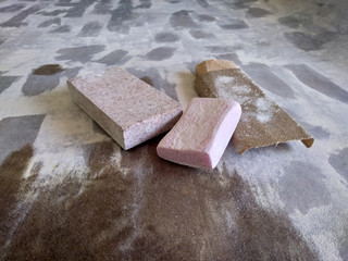 Sandpaper and grinding block on the working surface.