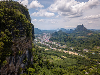 Fototapeta na wymiar Aerial view of the small Thai town of Phang Nga surrounded by jungle and mountains