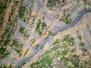 Aerial drone view of deforestation of a tropical rain forest to make way for palm oil and construction