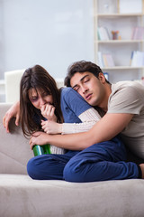 Obraz premium Drunk husband abusing wife in domestic violence concept