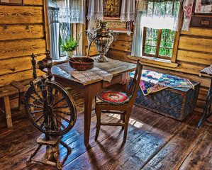 interior of   Russian log hut with elements of the old way of life