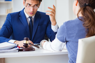 Lawyer talking to his client in office