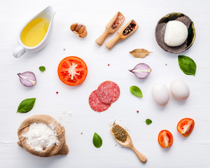 The ingredients for homemade pizza with ingredients sweet basil ,tomato ,garlic ,bay leaves ,pepper...
