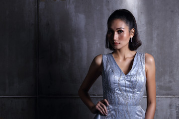 Fototapeta premium Asian Long straight black hair tan skin woman in Black dress