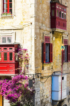 Building with traditional colorful maltese balcony
