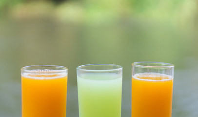 Closeup orange and guava juice with water nature background, drink for healthy concept, selective focus