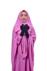 Religious asian muslim woman raising hand and pray