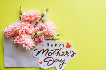 bouquet of pink chrysanthemums on yellow background.Pink chrysanthemum flowers.Happy Mother's Day Pastel Candy Colors Background. Floral mothers day