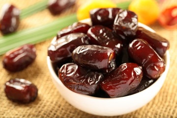 Bowl of delicious and healthy  organic wild date fruits 