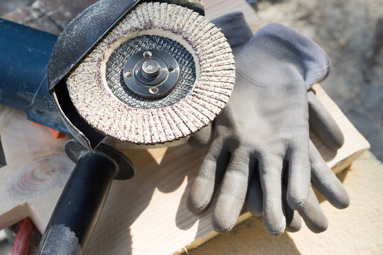 Angle grinder and working gloves 