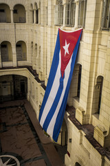 Cuban flag waving in a palace as a symbol of freedom