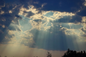 rays of light through thunderclouds