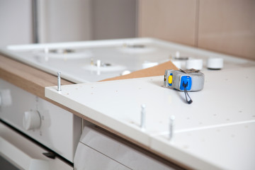 tape measure on flat pack furniture - DIY concept