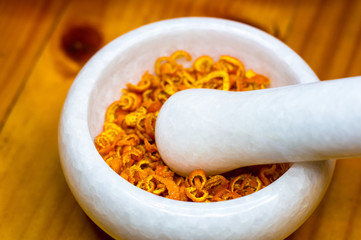 White marble mortar with the orange zest