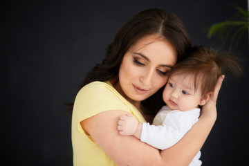 The happinest mother embracing her daughter