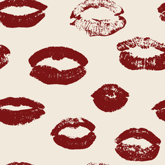Seamless pattern with red women's lips on pink background