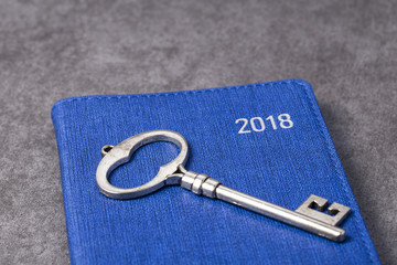 Symbol of the house with silver key on grey background