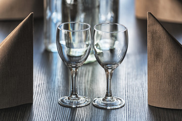 Served desk in a restaurant with muted light ready for the arrival of guests