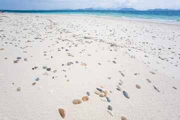 Fototapeta na wymiar Gravel sand beach on sunny summer.