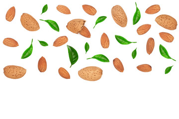 almonds decorated with leaves isolated on white background with copy space for your text. Top view. Flat lay pattern