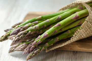 Fresh and green asparagus on the wooden table,