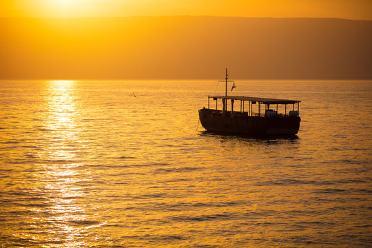 Beautiful Sea of Galilee in the morning. Golden sunrise over Kinneret