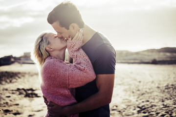 couple in love outdoor on the beach during vacation in tenerife