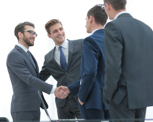 Fototapeta premium Successful business people shaking hands in an office.