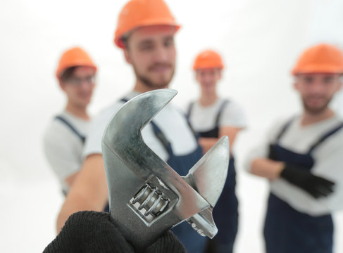 closeup. the wrench in the hands of the builders
