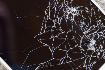 Broken display screen. Damaged smartphone glass. Closeup, selective focus