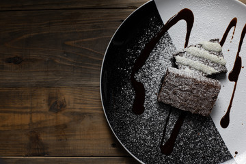 Cake chocolate brownies on wooden background